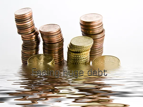 facing huge debt